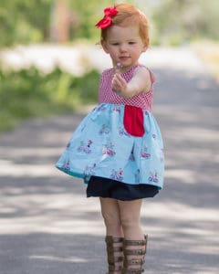 Simple Life Pattern Company Baby Jaimesyn Double flutter pocket dress. PDF sewing pattern for baby sizes Newborn - 24 months. SLPco Simple bodice, single ruffle or double ruffle bodice angel sleeves. tank top cap or long sleeves. big pockets. advanced beginner sewing pattern babies. full bodice back or v back option.