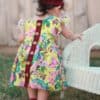 Baby Helena's Button Back Top and Dress. PDF Sewing Patterns Baby Sizes NB-24 Months. Top, Dress, Spring, Summer, Fall, Winter, Pintuck Placket, Button Back, Sleeveless, Sleeves, Baby, Newborn, Flutters, High-Low