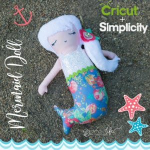 Simple Life Pattern Company Cricut Maker Simplicity creative group cutting machine mermaid doll pdf downloadable sewing pattern cricut design space 8067 d mermaid tail hair flower bow clip chunky glitter canvas art gallery fabrics liberty of london tana lawn blue pink floral explore air 2 silhouette cameo 2 3