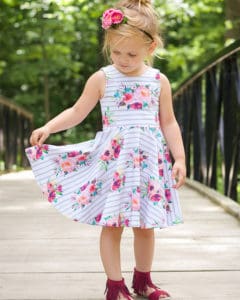 Simple Life Pattern Company | Skyler's Square Back Top & Dress Downloadable PDF Sewing pattern for toddler and girl sizes 2t-12 Skyler's Square Back Top & dress is loaded with is many options.   Skyler features three different back options, making this pattern the perfect staple for every season.  Open square back with side bows or a large center bow, square cutout back with side bows or a simple square back.  A modest line is available for those that love the look of the back but need a little more coverage.  Choose from sleeve tabs, short sleeves, elbow sleeves, long sleeves or sleeveless.  The higher bodice is perfect for adding embellishments or monograms.  You have the choice between a circle skirt or gathered skirt.  Peplum, tunic or dress length.  The top length pairs beautifully with the Tammy Tulip shorts.