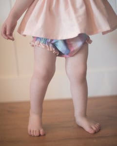 Simple Life Pattern Company | Rosie's Ruffled Bum Bloomers. Downloadable PDF Sewing Pattern for Babies and Toddlers Size Newborn to 3T. Rosie's Ruffled Bum Bloomers are just the pattern you've been looking for. Featuring a ruffled bum and optional leg ruffles, you can create a variety of looks with this one pattern. Slim fit or bubble fit.  Uses 1/2" elastic at the waist and 1/4" elastic for the legs.  