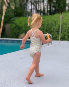 Simple life Pattern Company | Baby Marina's Criss Cross Tankini and One Piece. Downloadable PDF Sewing pattern for Baby sizes Newborn to 24 months. Baby Marina features the on-trend criss-cross strap in the back.  It can be sewn as a one piece or a tankini.  Both versions can feature the optional top ruffle or it can be made as a simple swimsuit without the ruffle.  The tankini also has an optional skirt ruffle for the ultimate girly swimsuit.  Fully lined or partial lining.  A shorten/lengthen line is included for the perfect fit and coverage you may want.  If you prefer a one piece for more sun coverage, an optional snap crotch panel is included for easy diaper changes.