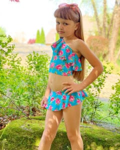 Simple Life Pattern Company | Elise's One Shoulder Swimsuit & Tankini. Downloadable PDF Sewing Patterns for Toddler and Girl Sizes 2T-12. Elise's One Shoulder swimsuit can be sewn as a one piece or a tankini.  Both versions can feature the optional flounce and skinny strap or be left as a simple single shoulder suit.  The tankini also has an optional circle skirt for the ultimate girly swimsuit.  Fully lined or partial lining.  A shorten/lengthen line is included for the perfect fit and coverage you may want.
