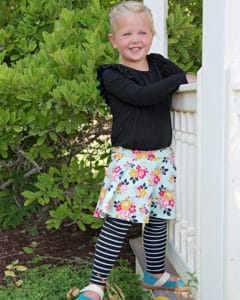 Simple Life Pattern Company | Roxie's Skirted Leggings. Downloadable PDF Sewing Pattern for Sizes Toddler and Girls sizes 2T-12. Roxie's Skirt Leggings are perfect for pairing with all our tops, especially the Lydia or Autumn. Roxie features 3 patterns in 1 pattern. Simple basic leggings, skirted leggings or a simple skirt.  There are three legging lengths- pants, capri or shorts.  Roxie features a waist yoke, elastic waistband and optional faux drawstring. This is sure to become a staple pattern for any season from back to school to hot summer days and everyday in between.