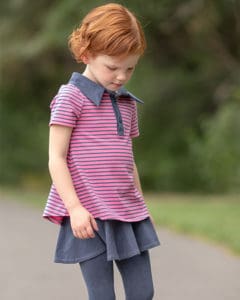 Trixie's Sporty Top & Dress Downloadable PDF Sewing Pattern for Toddler and Girls Sizes 2T-12. Trixie is a sporty dress with a beautiful A line drape.  Featuring a henley placket and collar, 2 lengths: swing top and dress, and optional inseam pockets. The pattern includes 4 sleeve lengths: sleeveless (which is finished with arm bands) short sleeve, elbow sleeve or long sleeve. Trixie is full of twirl and perfect for any occasion whether it's back to school, golf lessons or playing at the playground.