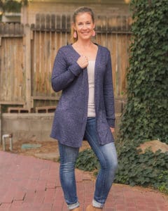 Simple Life Pattern Company | Tiegan's Cozy Cardigan & Duster for Women Sizes 00-20. Tiegan is a relaxed/ loose fitting cardigan and duster drafted for your favorite sweater knits, double brushed poly, or favorite cozy knit.  Tiegan has 3 lengths to choose from, crop, cardigan or duster.  The crop and cardigan have 2 different hem lines you can choose from, curved or straight, while the duster offers only the straight hem with a side vent.  You can choose a simple neckband or ruffled neckband for an added detail design.  With 4 sleeve options this pattern can transition easily through all of the seasons.  Choose from sleeveless, a simple long sleeve, cuffed long sleeve or a ruffled cuff long sleeve.  Tiegan looks great with jeans and a t-shirt or dress it up for a night on the town with a dress and some boots. 