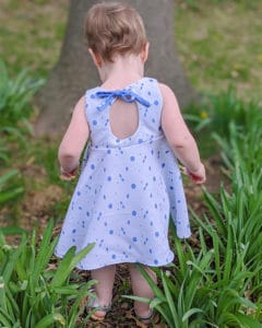 Simple Life Pattern Co. | Baby Ivy's Angel Sleeve Top & Dress. Downloadable PDF Sewing Pattern for Babies Size Newborn to 24 Months. Ivy is a sweet vintage inspired beauty! Ivy's Angel Sleeve Top & Dress features babydoll style bodice that can be sewn simple or with the optional pin tuck placket for such a sweet look.  The angel sleeves on Ivy give this pattern such a feminine and sweet look.  It can also be made sleeveless if you prefer.  There are 3 skirt options for Ivy: a top length, vintage length, and a knee-length! The skirt has options for a simple gathered skirt or circle skirt that is sure to have your girl twirling the day away! The look is finished with a beautiful circle keyhole in the back with a tie closure.  