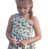 The Simple Life Company Downloadable PDF sewing pattern. Sierra's One shoulder top dress and maxi length sewing tutorial with projector file and A0 file. Fast easy woven dress for little girls and kids sizes 2t-12. Front or back button down trendy dress for toddlers. Holiday special occasion and party dress.