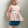 Simple Life pattern company Downloadable pdf projector file sewing pattern Summit Pocket shorts with ruffle waistband. Welt and side seam pockets. Designed for woven fabrics such as linen, quilting cotton, pima, denim and more. Girls baby and teen sizes 2t, 3t, 4t, 4, 5, 6, 7, 8, 10, 12, 14, 16. Slim fit shorts elastic back waistband. petite ruffles. modern, fast, easy tutorial.